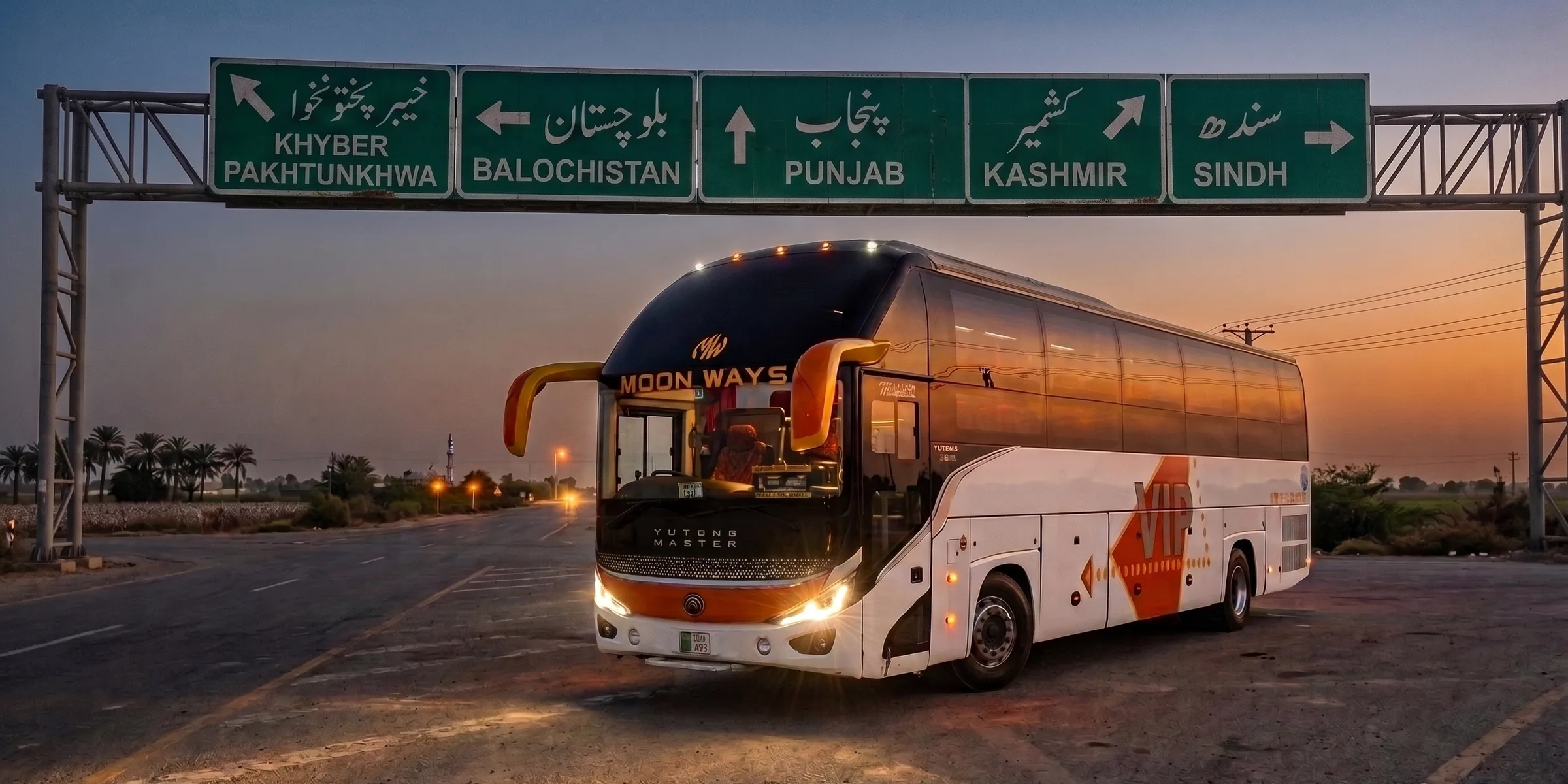 A Moon Ways bus at dusk under highway signs to Khyber Pakhtunkhwa, Balochistan, Punjab, Kashmir and Sindh