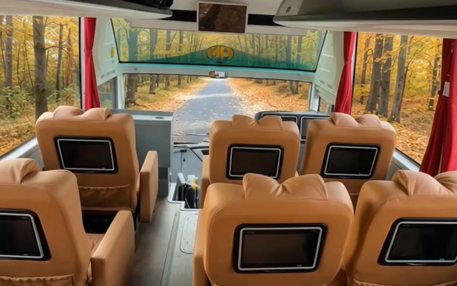 Premium Plus cabin: tan leather sofa seats two-plus-one with seat-back screens